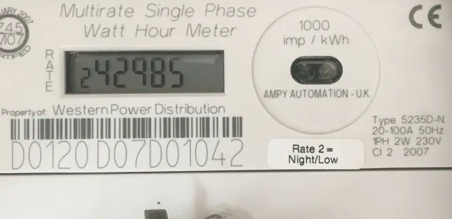 An electric meter with the meter serial number displayed beneath a barcode.